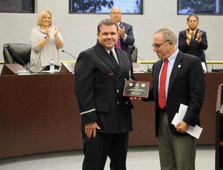 Firefighter Suder receives award from Mayor Sirkin